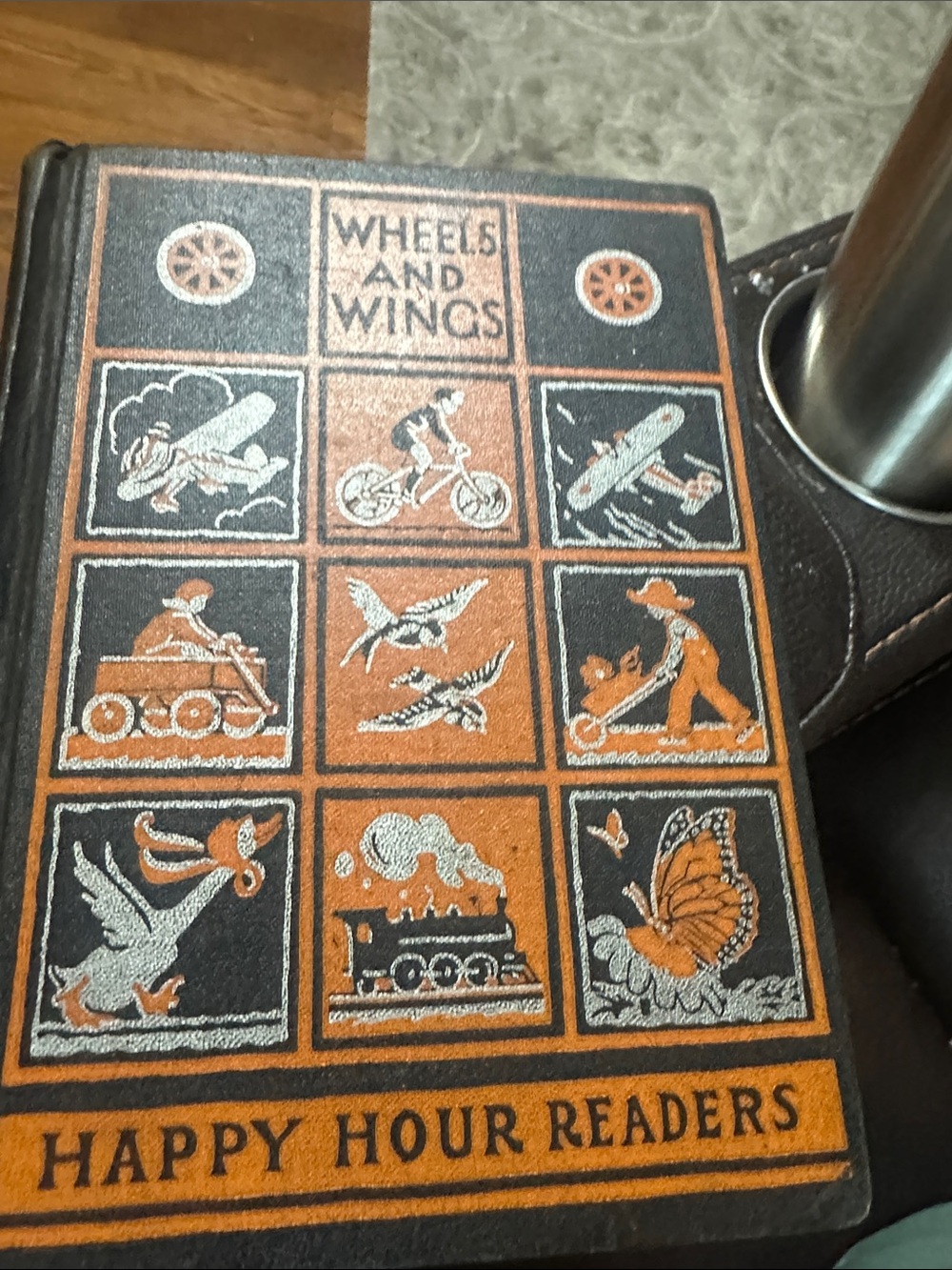 Vintage Wheels and Wings Happy Hour Reader Orange and Black Basal Reader